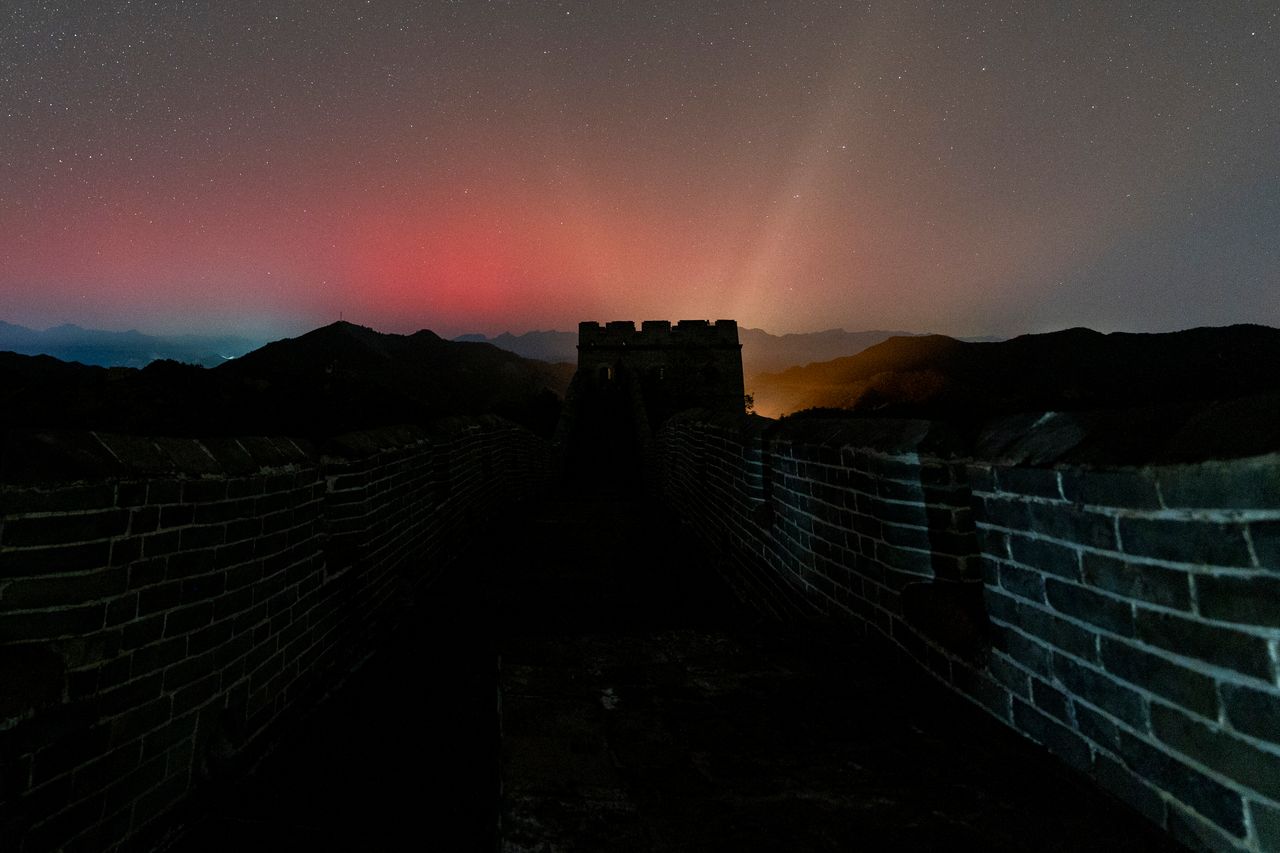 The lights are seen over the Jinshanling Great Wall in Chengde, Hebei Province of China. 