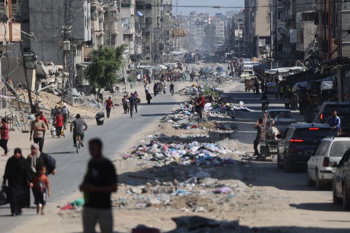 Palestinians carry their belongings as they flee areas north of Gaza City in the northern Gaza Strip on October 12, 2024. (Photo by OMAR AL-QATTAA/AFP via Getty Images)