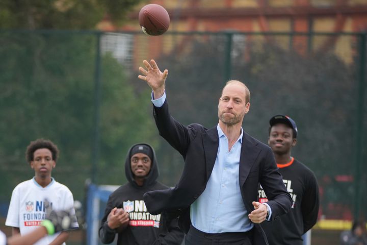 Prince William played catch with British teenagers at a flag football event organized by the NFL on Tuesday.